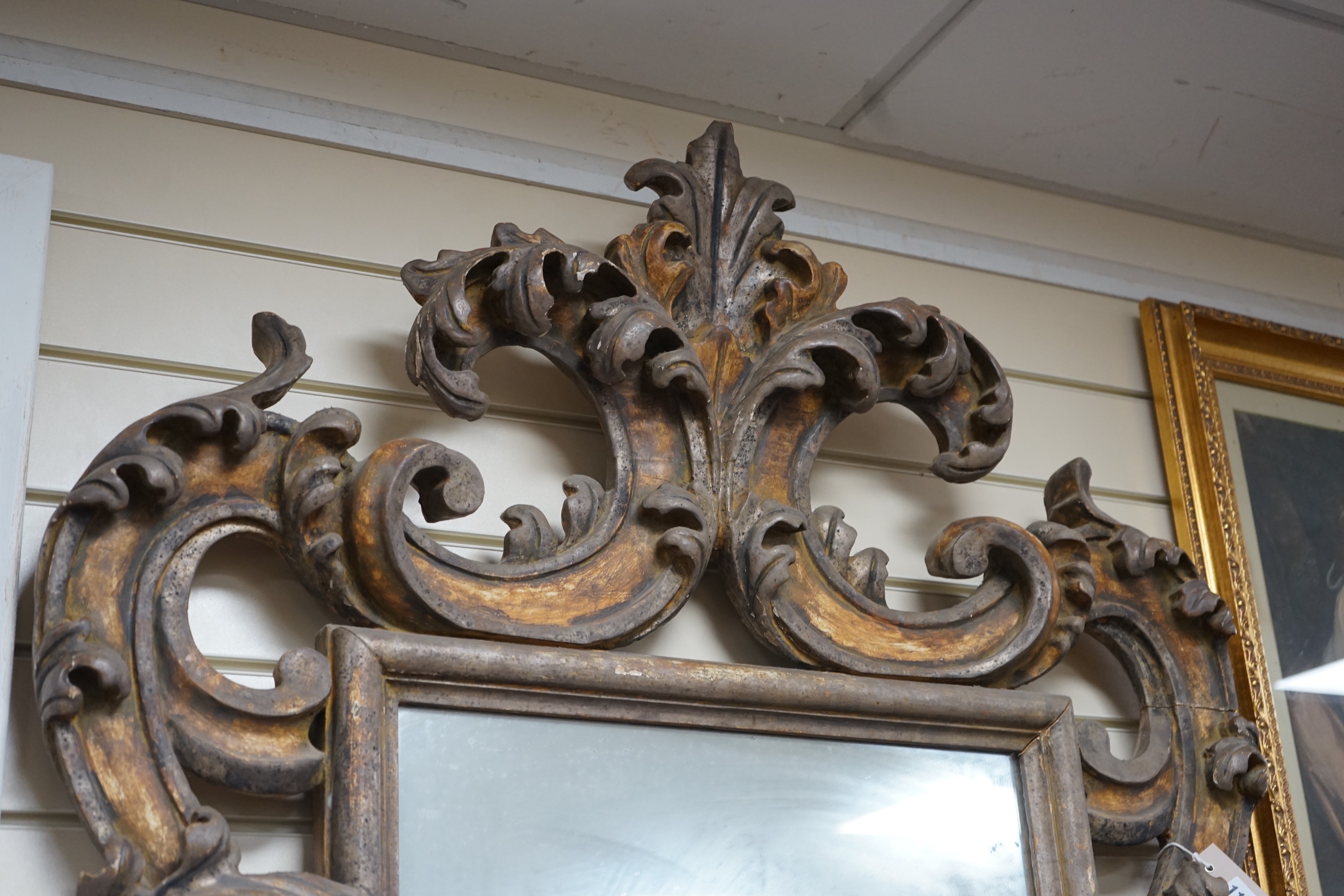 An 18th / 19th century Florentine style carved gilt gesso wall mirror, width 85cm, height 116cm